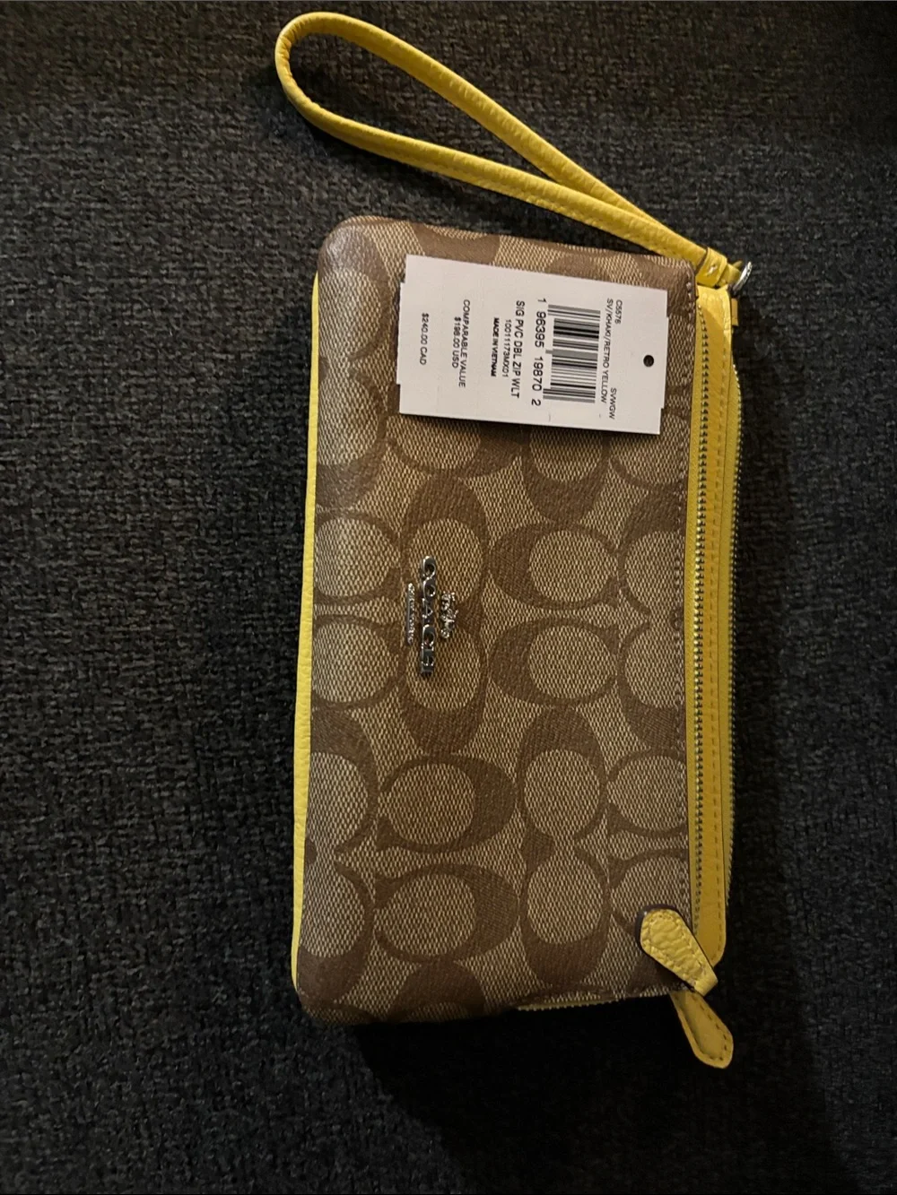 Coach Brown Signature Canvas Wristlet with Yellow Trim. New with tag. Never used
